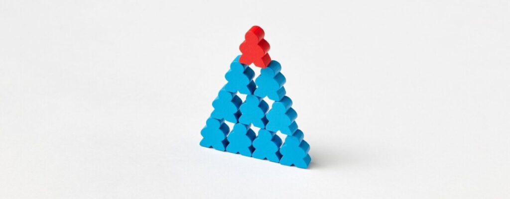 A 3D Image of a pyramid of people, blue people on the bottom and one red one on top