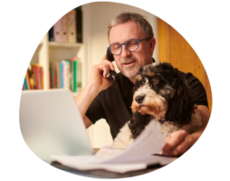 Businessman working from home with dog ICHRA